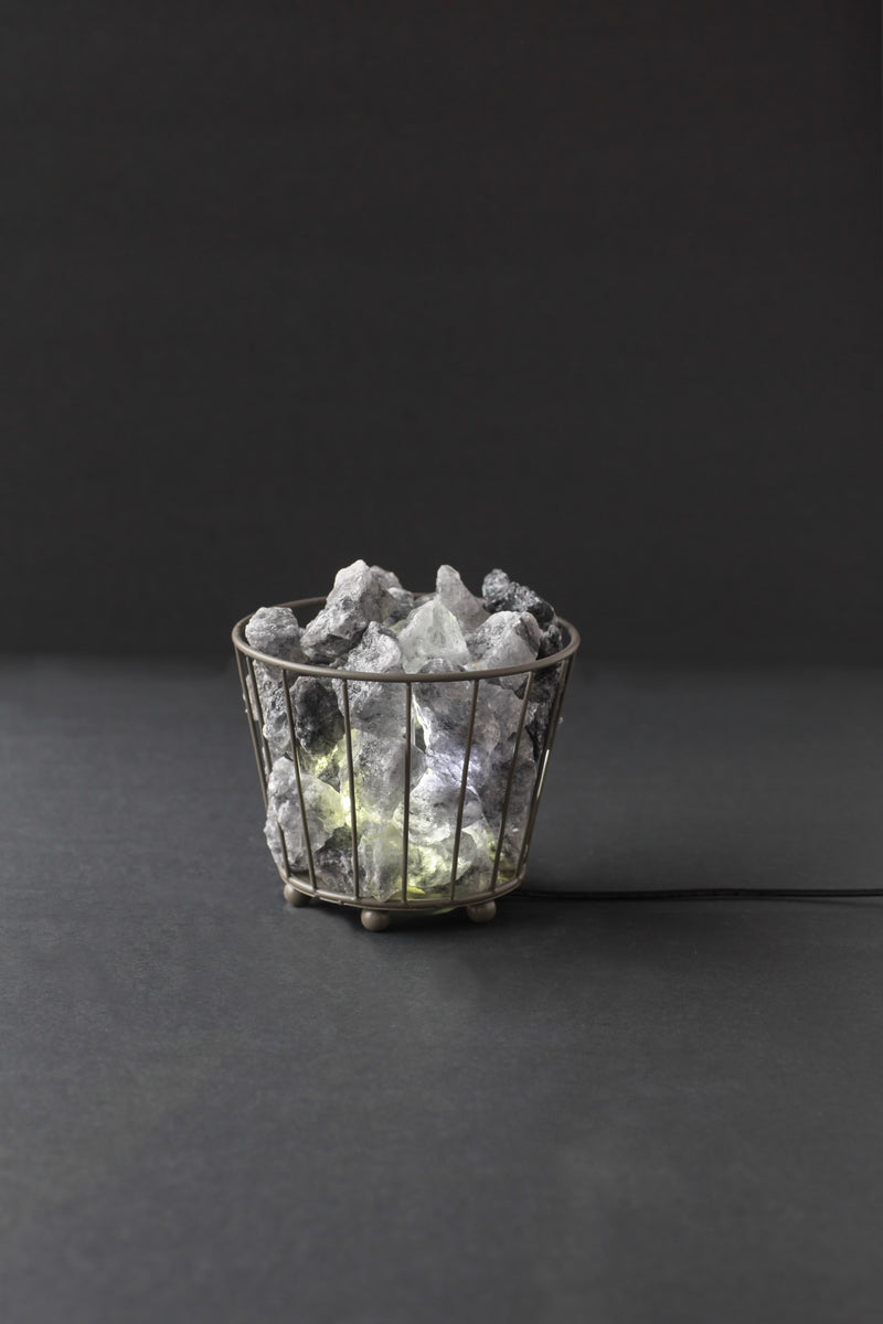 Small black metal basket Himalayan rock salt lamp with natural salt chunks and electric light